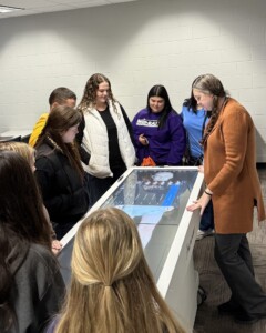 Radiology Program Director Julia Warren Showing Attending Students The Anatomage Table